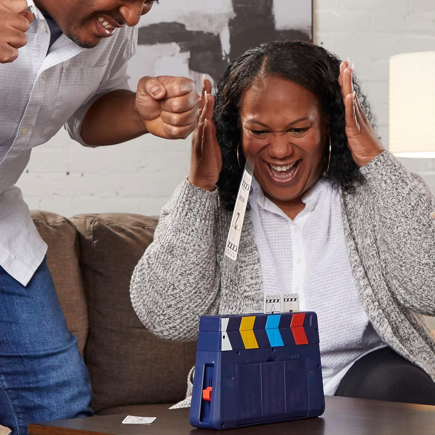 imageHasbro Gaming Guesstures Game Charades Games for 4 or More Players Includes Customizable Cards and Clapper Family Party Game for Ages 8 and Up