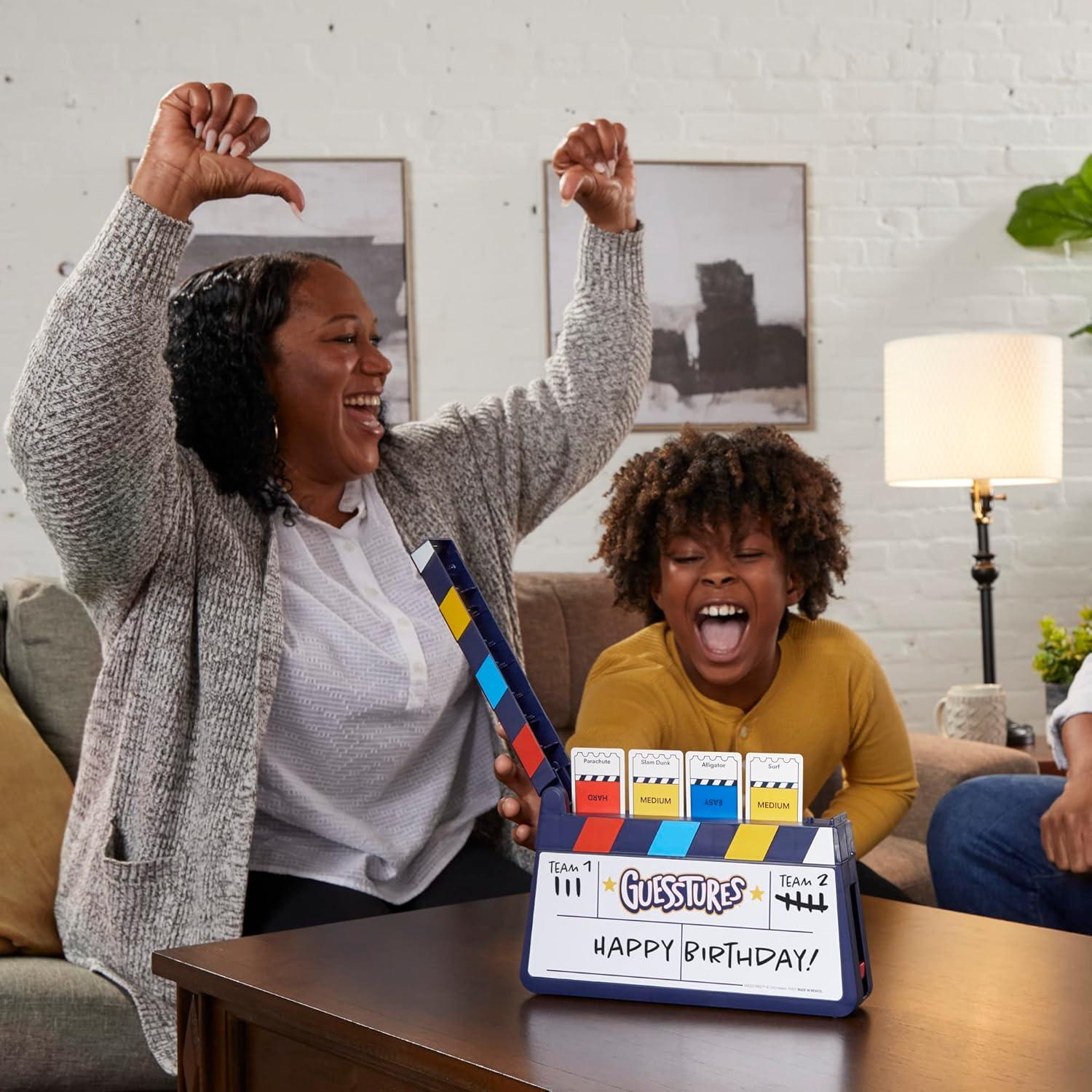 imageHasbro Gaming Guesstures Game Charades Games for 4 or More Players Includes Customizable Cards and Clapper Family Party Game for Ages 8 and Up