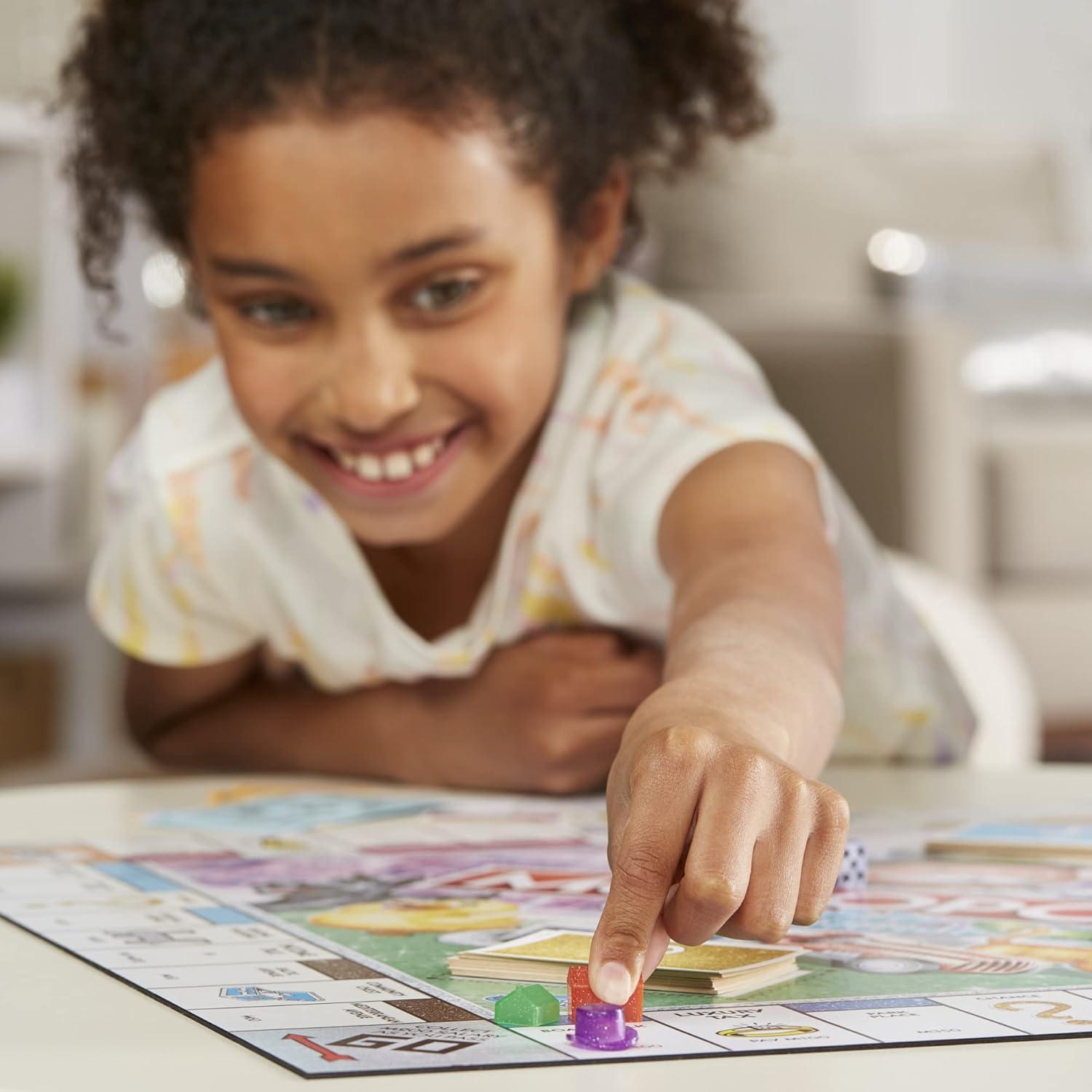 imageHasbro Gaming Monopoly Sparkle Edition Board Game Family Games with Glittery Tokens Pearlescent Dice Sparkly Look Amazon Exclusive