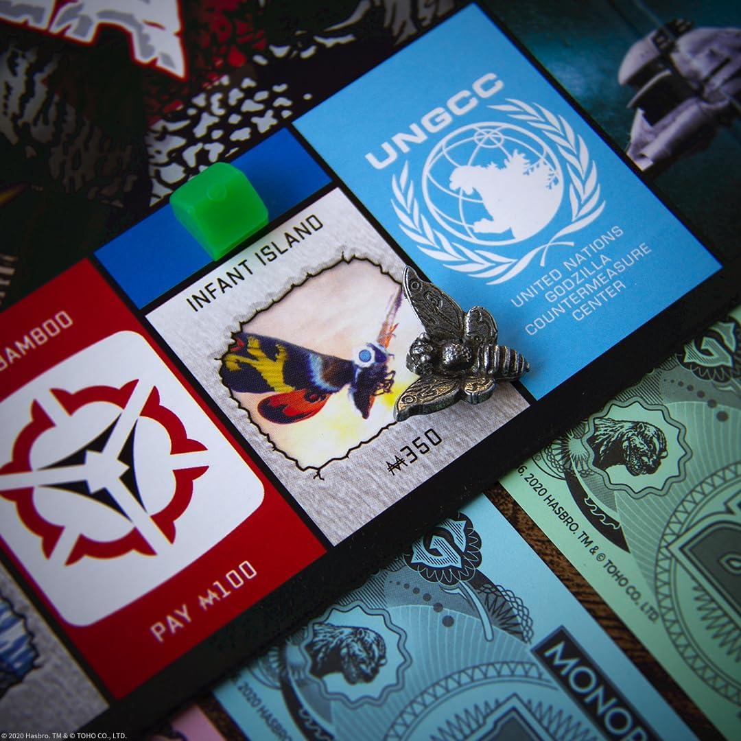 imageMonopoly Godzilla Based on Classic Monster Movie Franchise Godzilla Collectible Monopoly Game Featuring Familiar Locations and Iconic Kaiju Monsters