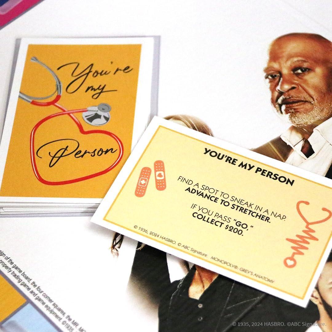 imageMonopoly Greys Anatomy Board Game Featuring Ferry Boat Clipboard Scrub Top and More Buy Sell Trade Iconic Doctors from Miranda Bailey to Meredith Grey Officially Licensed Collectible